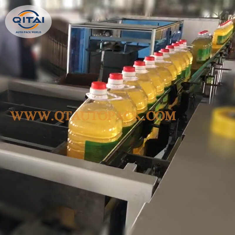 Cooking oil Drop loading carton pack machine
